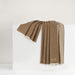 Brown scarf with a brand label on a white background