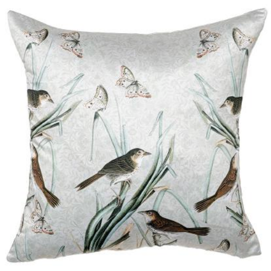 Decorative pillow with bird and butterfly pattern on a light background