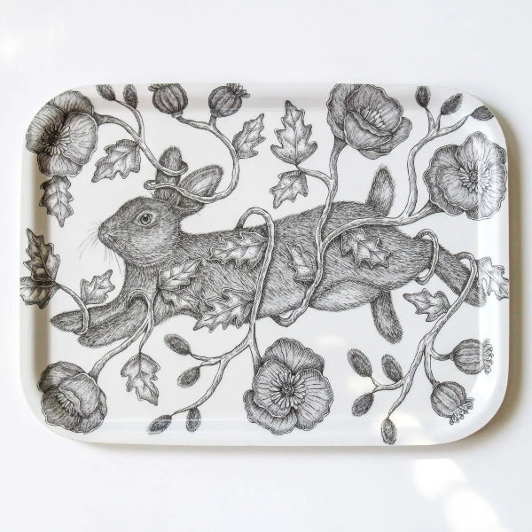 A white rectangular serving tray with rounded corners, featuring a detailed black and white illustration of a rabbit wrapped in flowers and leaves.