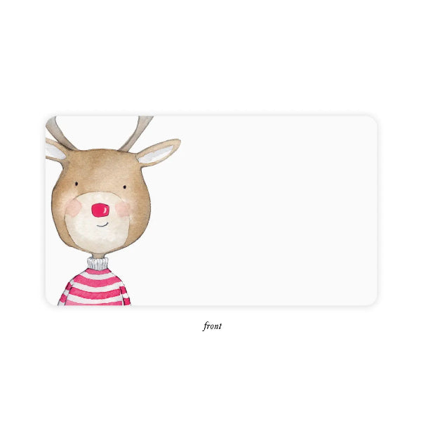 A rectangular white card or label with rounded corners, featuring a watercolor-style illustration of a reindeer on the left side. The reindeer is tan with a pink striped sweater, pink cheeks, and a red nose.