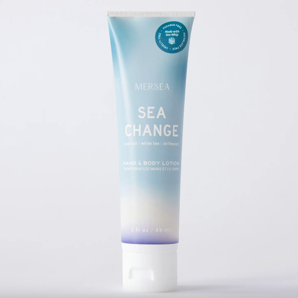 Tube of Mersea Sea Change hand and body lotion on a light gray background