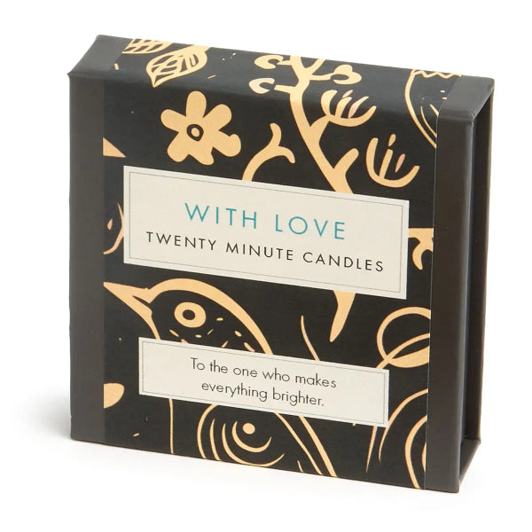 Box of 'Twenty Minute Candles' with decorative gold designs on a black background