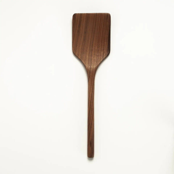 Wooden spatula on a white background